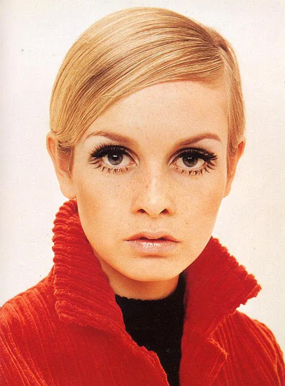 twiggy makeup with a bright red jacket 