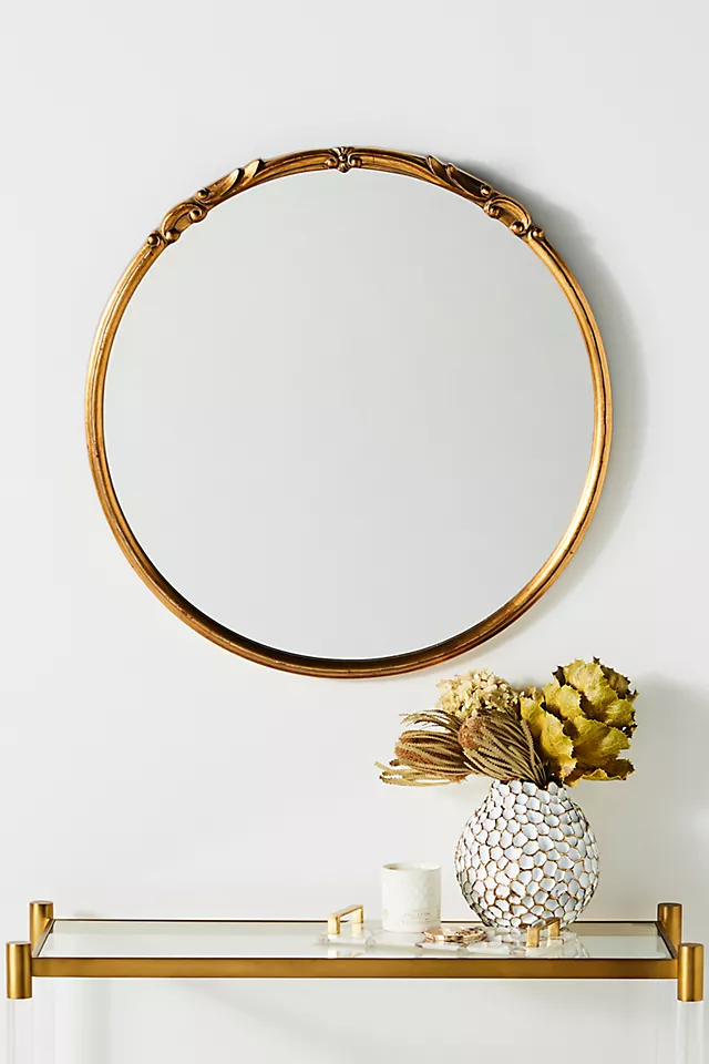 This Metal Arch Top Leaner Mirror is a chic dupe for Anthropologie's Tamara Burl Mirror. Its stylish black frame features a corrosion-resistant brushed aluminum metal finish.   So what are you waiting for? Get it now,  and lean it against your bedroom wall or closet for that dreamy look you desire!  11. WallBeyond 36" Round Wall Mirror